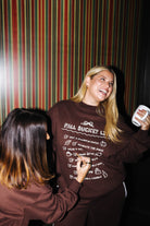 Fall Bucket List sweatshirt shown on another model