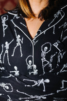 Close view of the collar and skeleton print on adult Skelly pajamas
