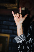 Striped cuff detail on adult Skelly pajamas