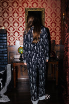 Back view of adult Skelly long pajamas