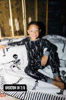 Britton wearing size 7/8 in the Kid Skelly Ribbed Pajama Set