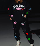 closer photo of the detailing with stars, cherry, heart, and smileys