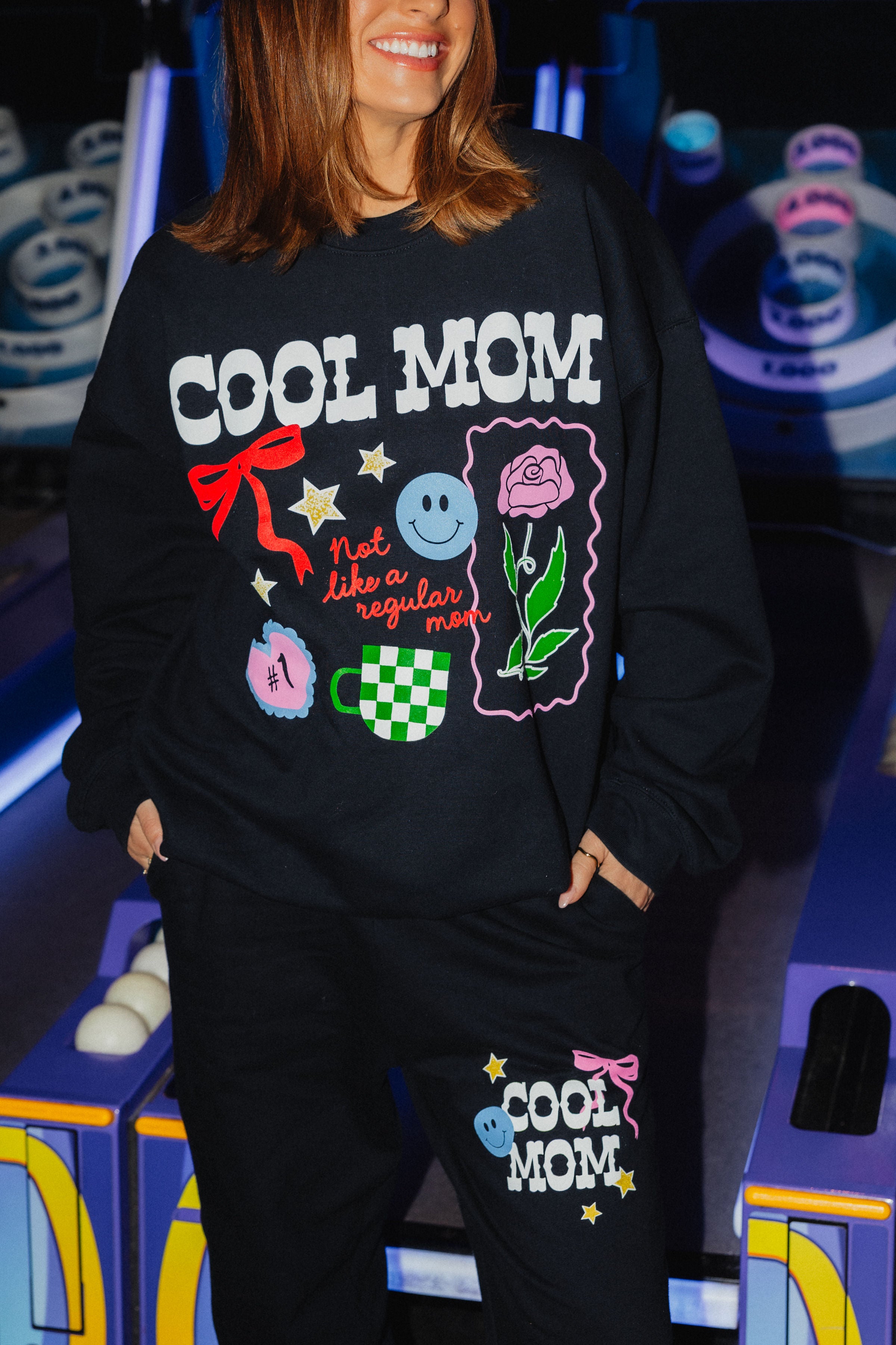 Closer up detailing on the sweatshirt and the sweatpants