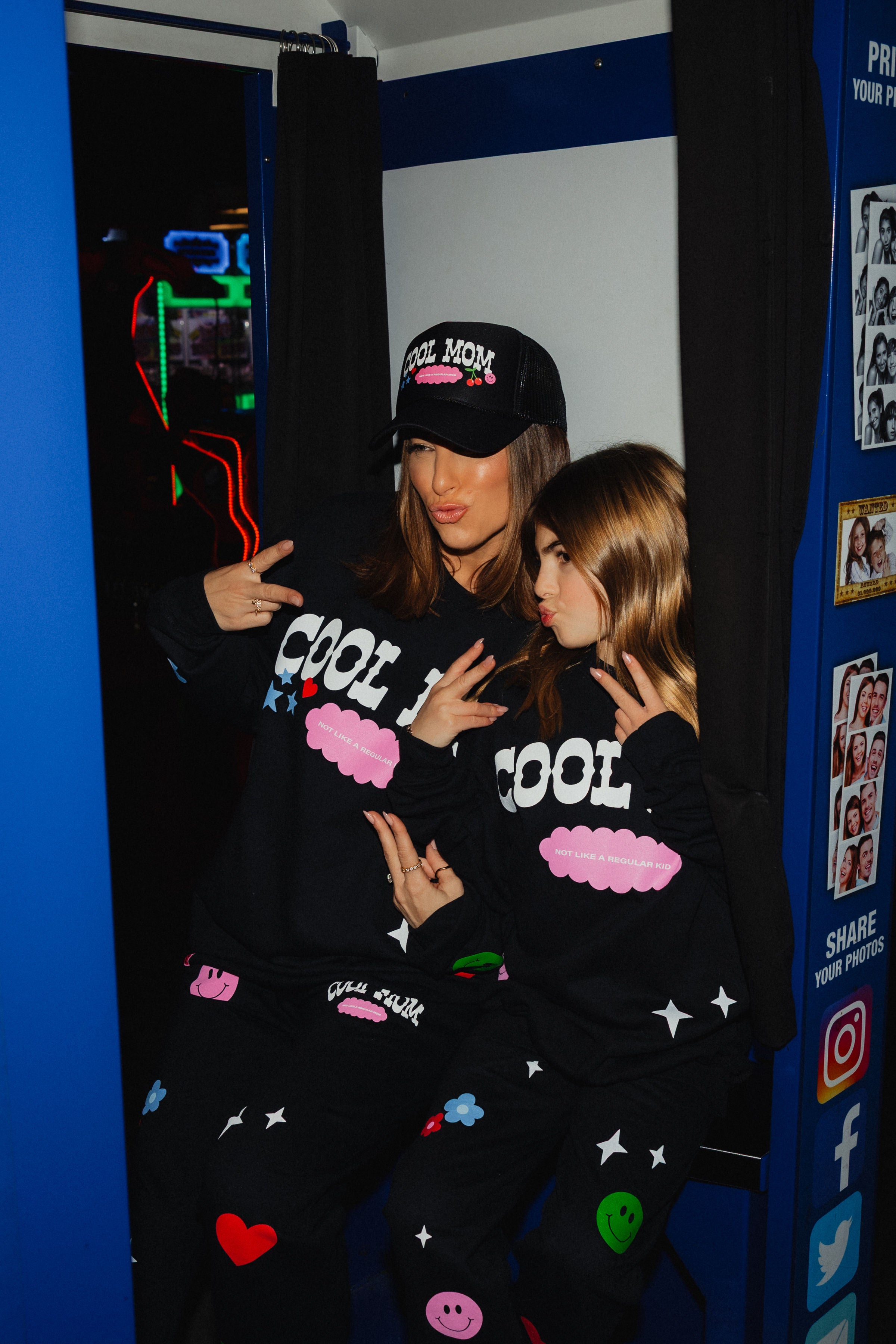 pic of them in the photobooth doing peace signs