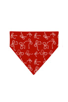 Red Bow dog bandana with white bow print on a red background